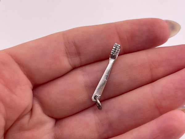 sterling silver rhodium plated toothbrush pendant