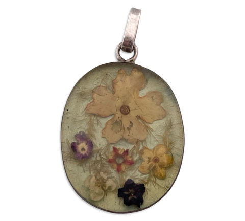 sterling silver flowers in resin pendant