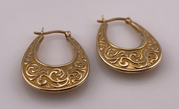 14k yellow gold 1 1/4" long textured scroll design puffy hoop earrings