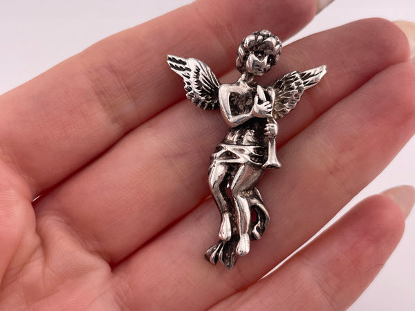 sterling silver cherub with instrument pendant