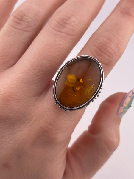 size 7.5 sterling silver scroll design oval amber ring