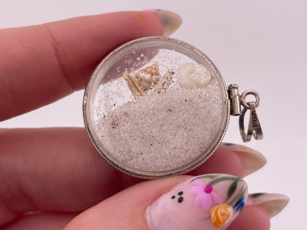 sterling silver sand filled plastic tiny seashells starfish pendant