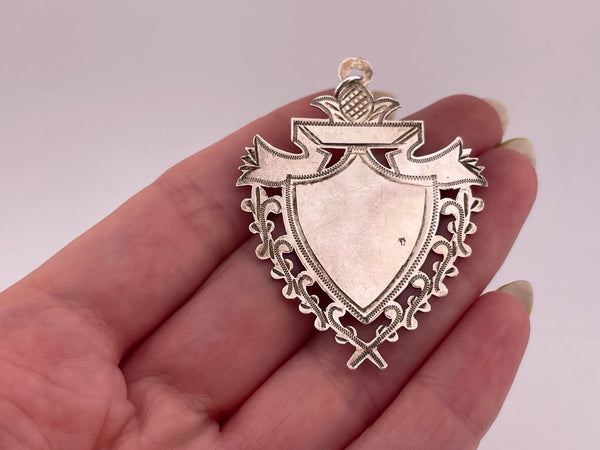 sterling silver thin shield pendant