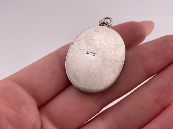 sterling silver flowers in resin pendant