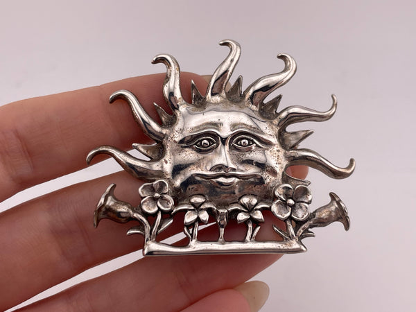 sterling silver man in the sun face flower brooch pin