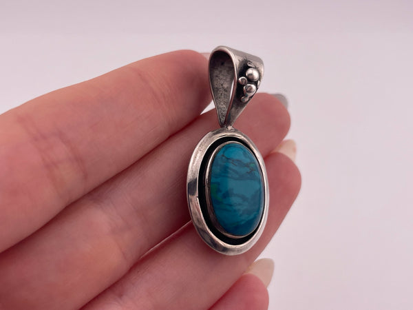 sterling silver synthetic blue swirl stone pendant