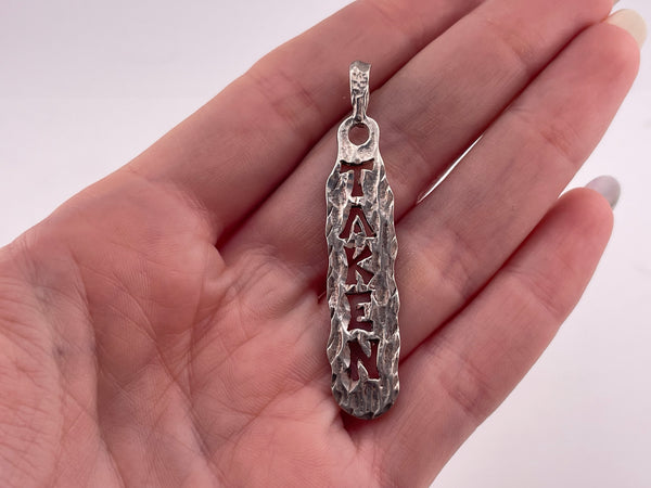 sterling silver "Taken" pendant