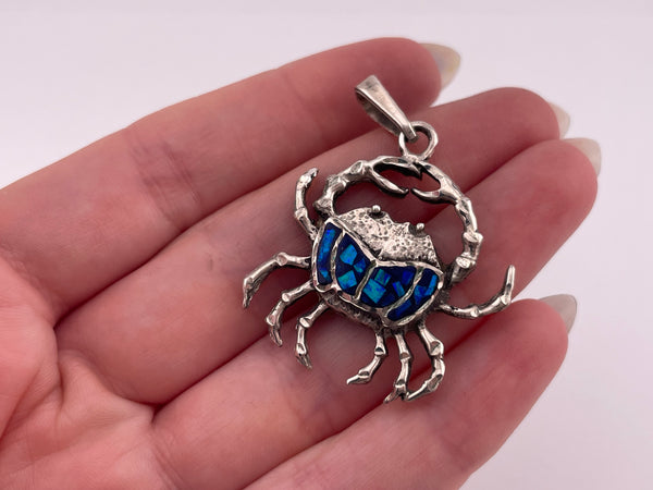sterling silver mosaic lab opal crab pendant