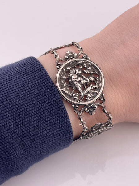 sterling silver 7" person riding bird panel link bracelet