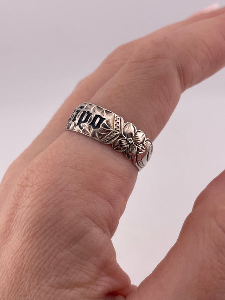 size 10.25 sterling silver “Kuuipo" flower scroll band  ring