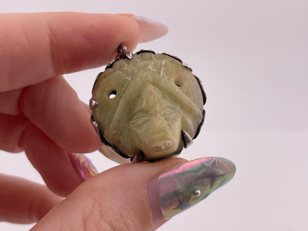 sterling silver Mexican carved stone face pendant