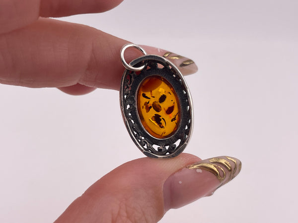 sterling silver amber oval scroll cut-out design pendant