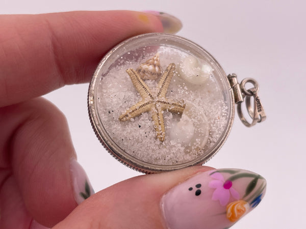 sterling silver sand filled plastic tiny seashells starfish pendant