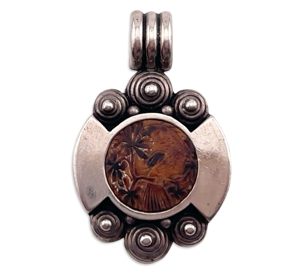 sterling silver bird on tree limb carved material pendant