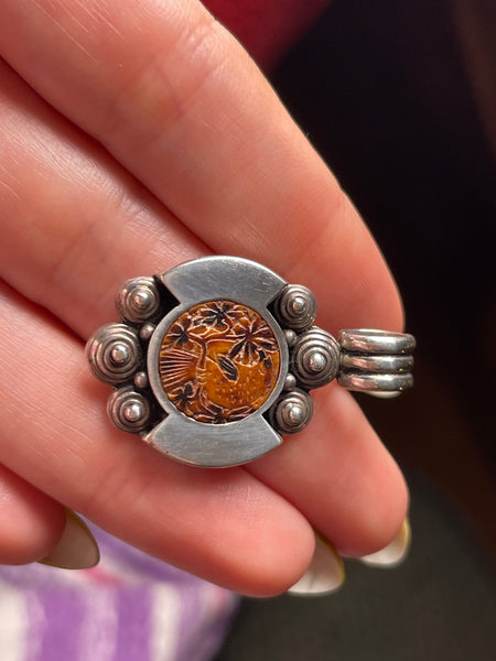 sterling silver bird on tree limb carved material pendant
