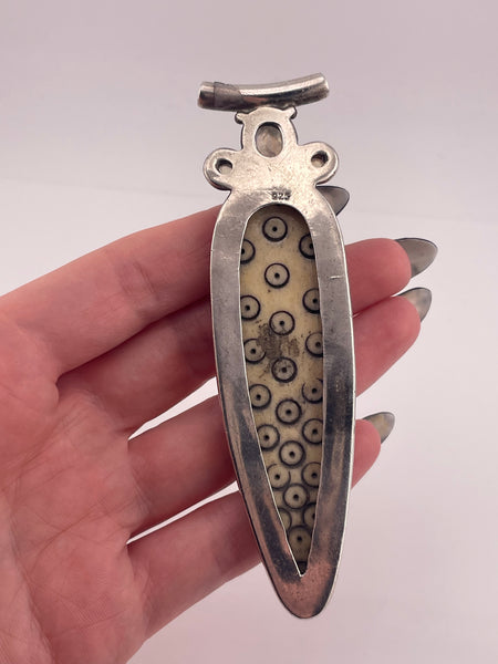 sterling silver 4-1/8" carved antler ? rainbow moonstone pendant