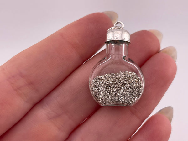 sterling silver silver dust in a bottle pendant