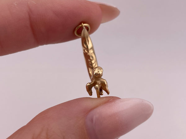 14k yellow gold 3D angel sitting on crescent moon pendant
