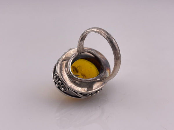 size 7.5 sterling silver scroll design oval amber ring