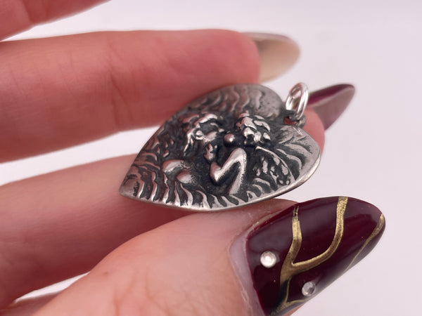 sterling silver kissing cherub heart pendant