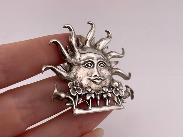 sterling silver man in the sun face flower brooch pin