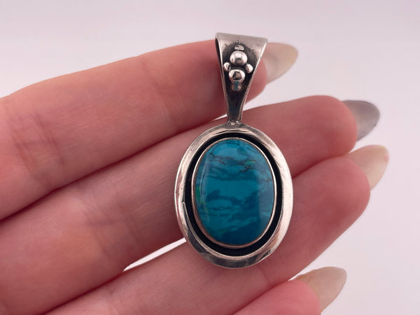 sterling silver synthetic blue swirl stone pendant