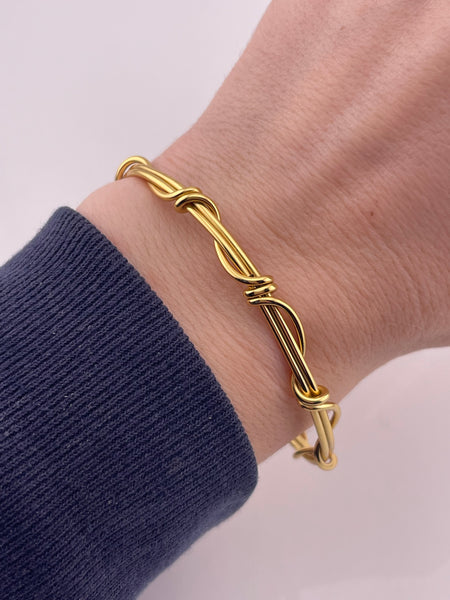 sterling silver 6-3/4" gold plated wrap around design bracelet