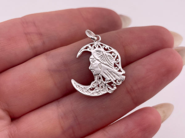 rhodium plated sterling silver woman in moon pendant