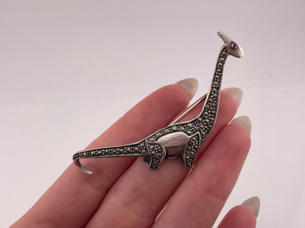 sterling silver marcasite red glass dinosaur brooch