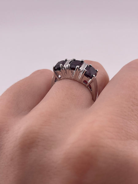 size 6 sterling silver rhodium plated faceted garnet row ring