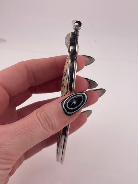 sterling silver 4-1/8" carved antler ? rainbow moonstone pendant