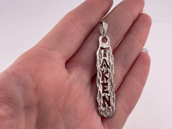 sterling silver "Taken" pendant