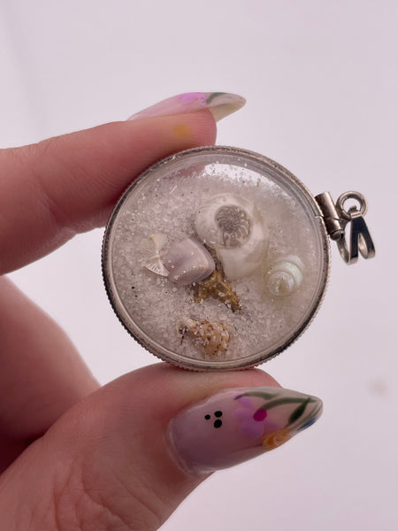 sterling silver sand filled plastic tiny seashells starfish pendant