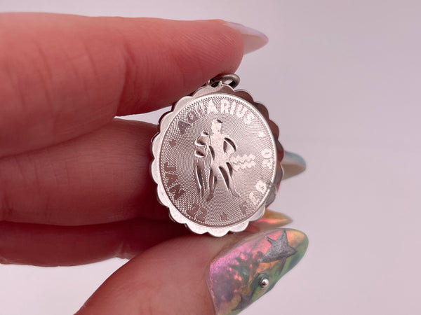 sterling silver rhodium plated Aquarius the Water bearer zodiac pendant
