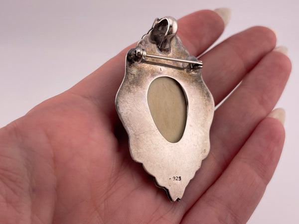 sterling silver molded plastic face pendant brooch