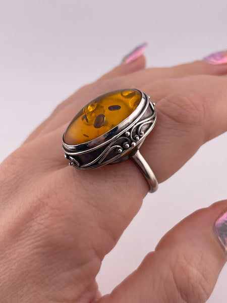 size 7.5 sterling silver scroll design oval amber ring