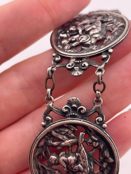 sterling silver 7" person riding bird panel link bracelet