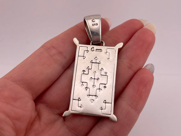 sterling silver crushed stone under resin pendant