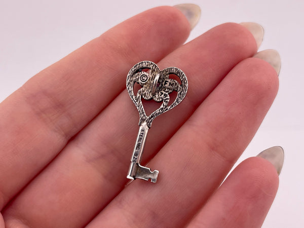 sterling silver faceted lab ruby key pendant