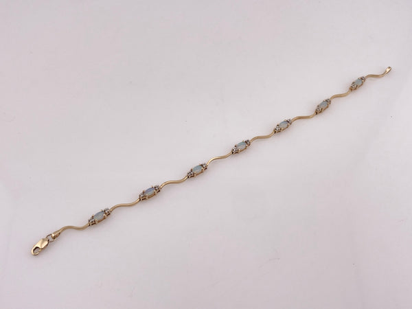 14k yellow gold opal & diamond squiggle link bracelet
