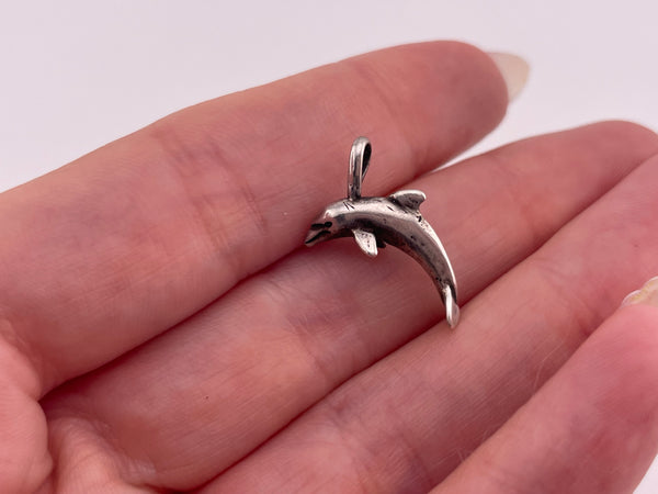 sterling silver tiny dolphin pendant