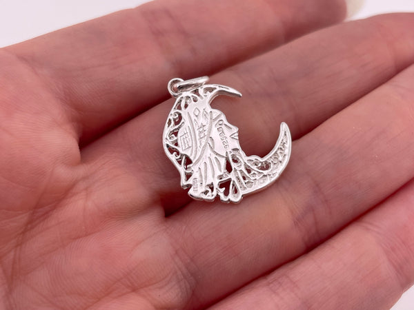 rhodium plated sterling silver woman in moon pendant