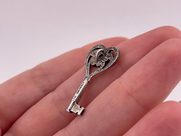 sterling silver faceted lab ruby key pendant