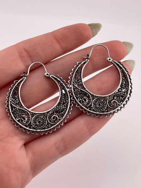 NOT STERLING - silver toned ornate flat hoop earrings