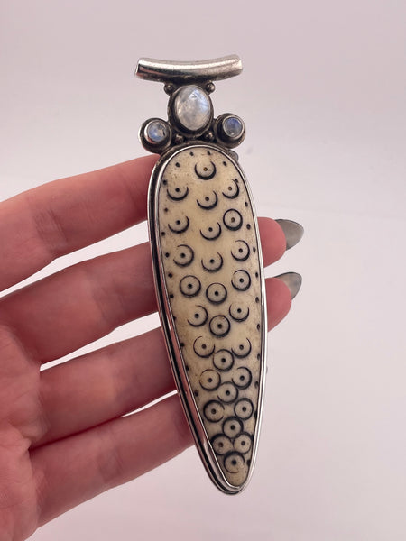 sterling silver 4-1/8" carved antler ? rainbow moonstone pendant