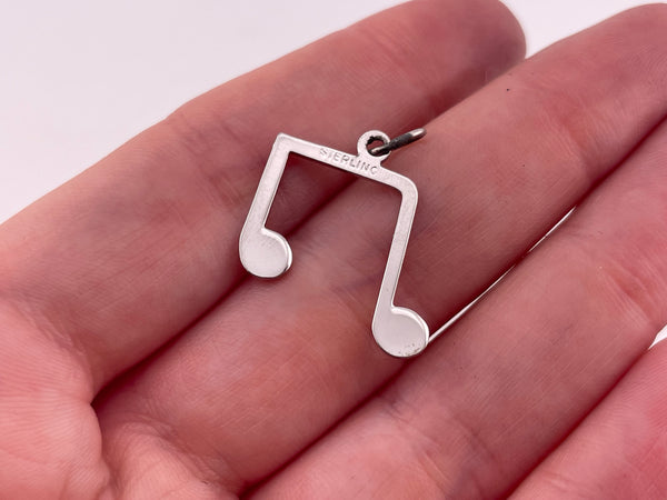 rhodium plated sterling silver music note pendant