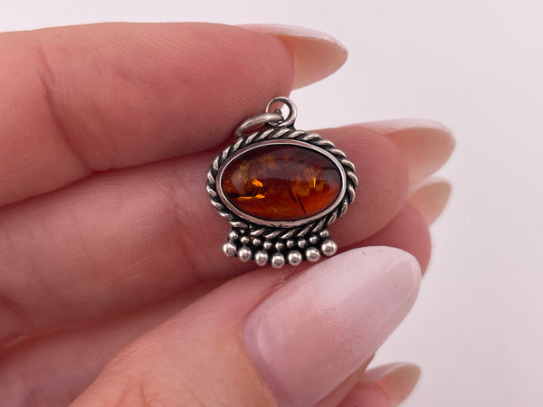 sterling silver oval amber rope edge pendant