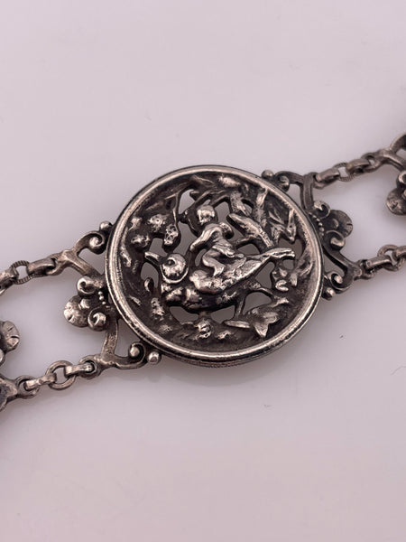 sterling silver 7" person riding bird panel link bracelet
