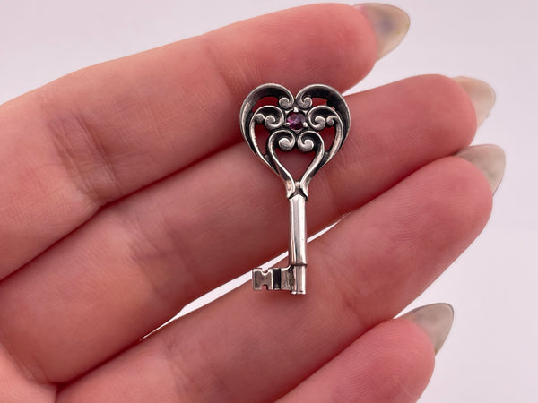 sterling silver faceted lab ruby key pendant