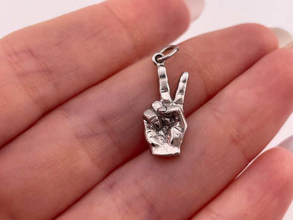 sterling silver rhodium plated peace sign fingers pendant